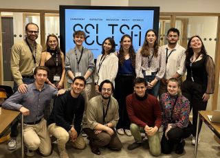 EELISA Student Council members pose in front of a screen that says EELISA